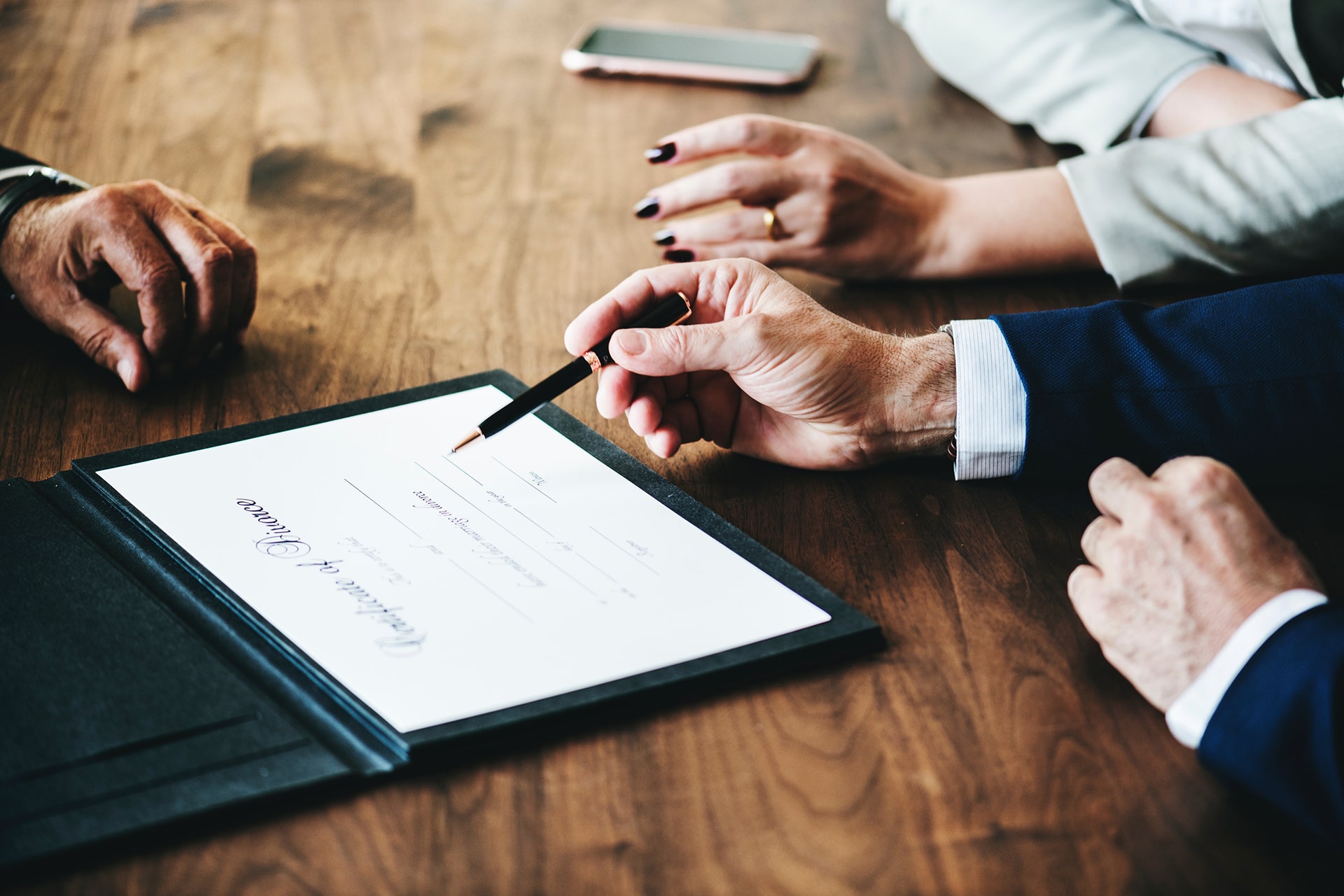 Beneficiary reviewing estate documents with a lawyer